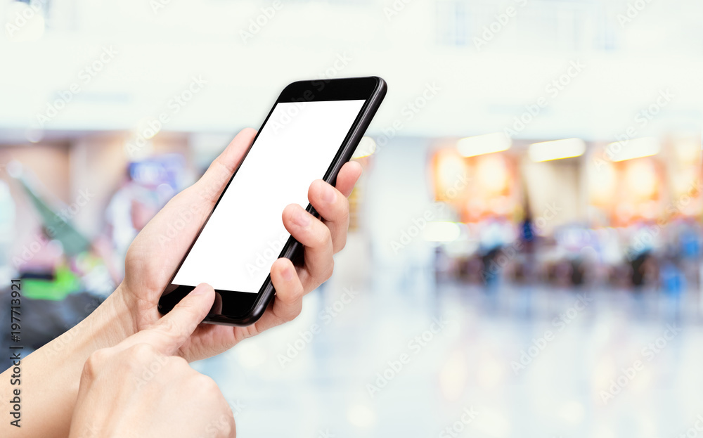 Aufkleber Hand click mobile phone with blur people travel at airport background bokeh light,White screen mock up template for adding your design or your text