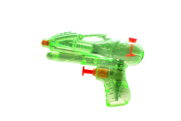 plastic green water gun on white background.