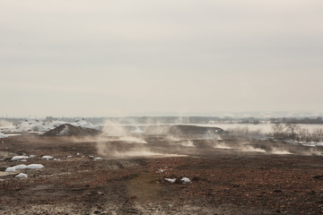 smoke on slag dump, pollution