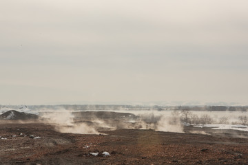 smoke on slag dump, pollution