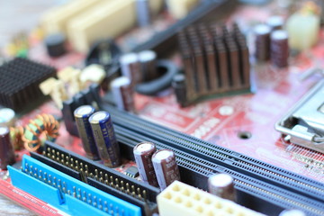Close up of Electronic Circuits Chipset on Mainboard computer on wooden ground