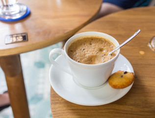 cup of coffee with heart pattern in a white 