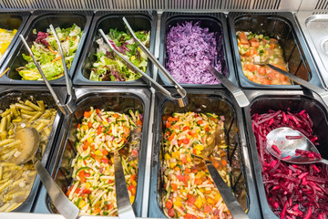 Colorful salads at a buffet in a restaurant