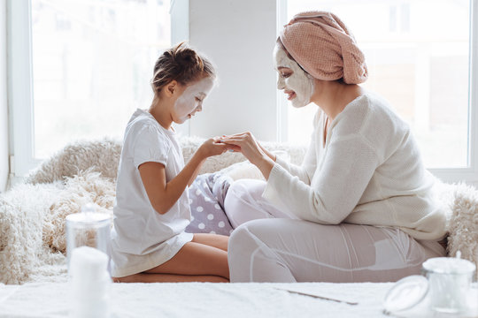 Mom With Her Daughter Making Clay Face Mask