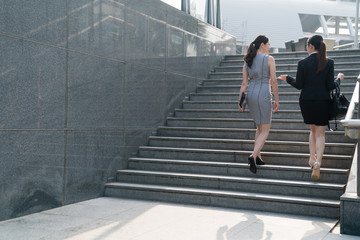 modern business woman climbing stairs.