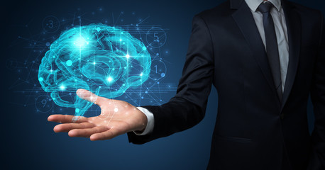 Man holding human brain on his hand