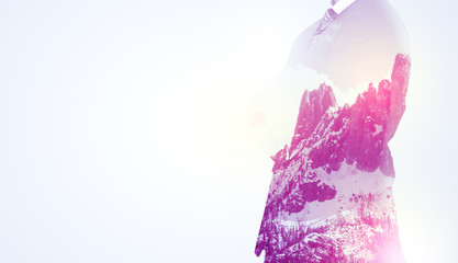 Businessman standing with mountain graphic