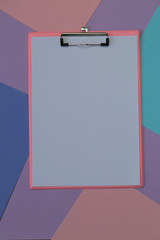 empty clipboard on trend  graphic background in pastel colors. Top view.
