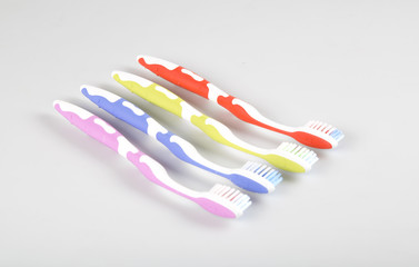 colorful toothbrush and tooth paste on the white background