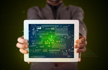 Businessman holding tablet with business plan concept