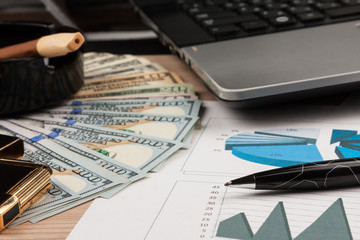 Workplace, work and habits. Dollars and cigar.