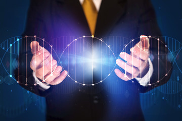 Businessman holding DNA