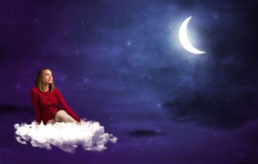Fototapeta na wymiar Woman sitting on cloud
