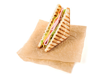 Sandwich with ham, cheese, tomatoes, lettuce, and toasted bread. Above view isolated on white background.