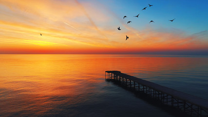 Aerial view over the old broken bridge in the sea, sunrise shot.
