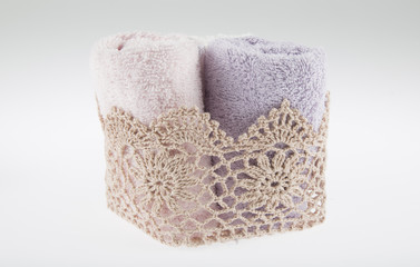 towels on the white background with red candle