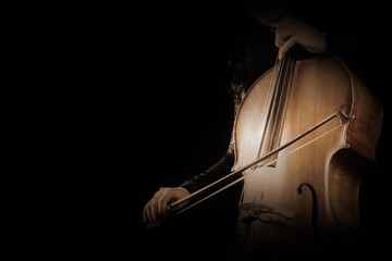 Cello player. Cellist hands playing cello with bow