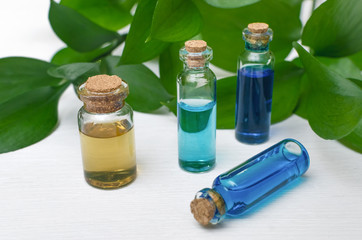 Blue essence oil tincture on white wooden background. Alternative medicine. Herbal medicine.