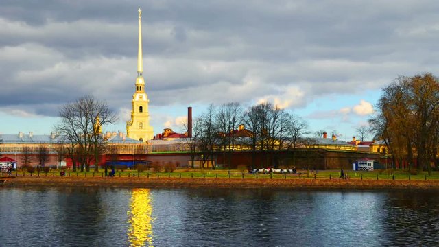 Saint Petersburg, Russia. Unidentified people walking by the entrance to Peter and Paul fortress. Popular landmark in the city. Time-lapse with cloudy sky in autumn