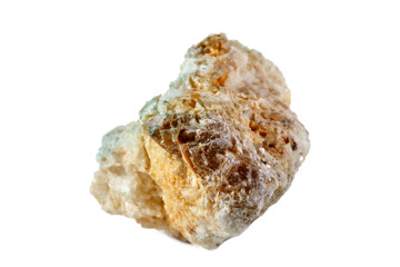Macro shooting of natural gemstone. The raw mineral is albite, Brazil. Isolated object on a white background.