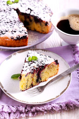 Blueberry cornmeal cake with icing sugar on top