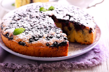 Blueberry cornmeal cake with icing sugar on top