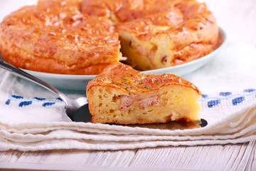 Meat and cheese quiche, sliced