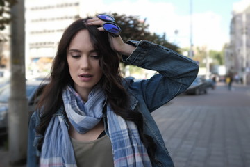 Pretty girl in jeans coat disturbed