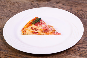 Pizza with ham and sausages