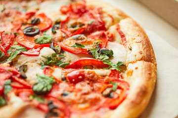 Pizza sweet pepper olives tomato