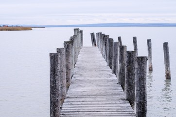 Wooden pier walk on a lake
