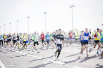 silhouette of people running marathon