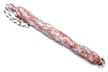 Dried organic salami sausage on white background