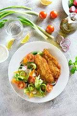Vegetable salad and schnitzel