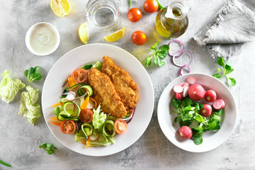 Vegetable salad and schnitzel