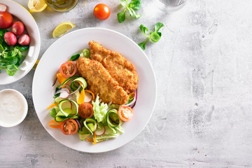 Vegetable salad and schnitzel