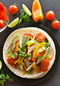 Healthy taco with chicken meat and vegetables