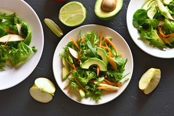 Salad with avocado, green pea, greens, apple
