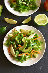 Salad with avocado, green pea, greens, apple