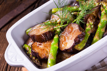 Eggplant casserole with green asparagus