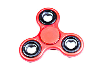 Red fidget spinner isolated on white