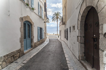 Fototapeta na wymiar Street in catalan village of Sitges, province Barcelona, Catalonia, Spain.