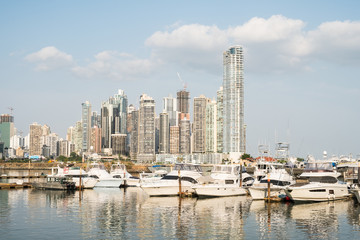 Fototapeta na wymiar Panama city skyline with yacht boats docked on harbor