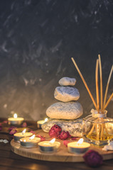 Spa composition-stones, candles, aromatherapy, dry flowers.