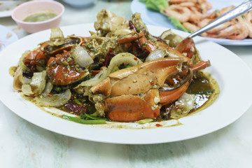 Spicy delicious black pepper hard-shell crab served on white plate