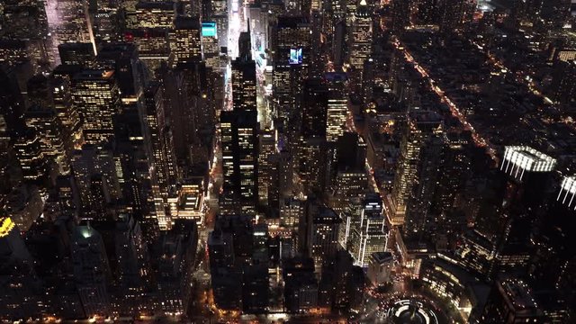 New York City night aerial view tilting up from Columbus Circle featuring Midtown and Downtown Manhattan Skyline 