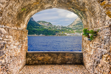 Rock balcony overlooking the island of Capri, Mediterranean Sea, Italy