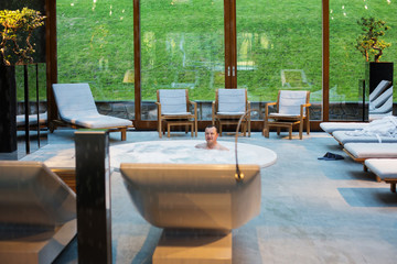  men in hot tub in  spa center