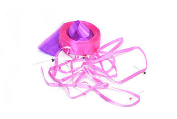 Ribbons and pins on a white background