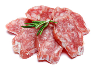 Dried sliced organic salami sausage on white background